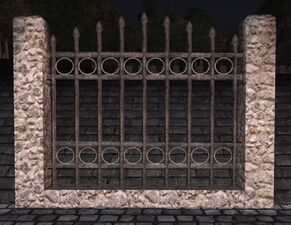 Rounded stone high iron fence
