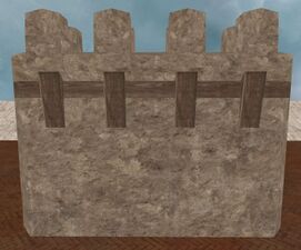Tall rendered stone wall